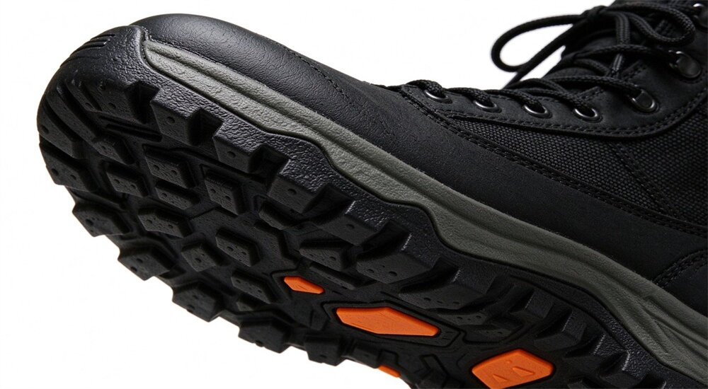 Waterproof rescue boots standing on wet grass and mud close up, non slip tread on soft wet ground, neoprene shell resisting swamp water penetration
